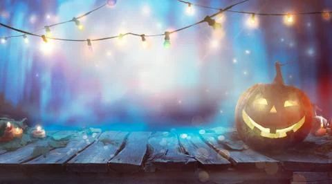 Halloween Design on table with string lights Stock Photos