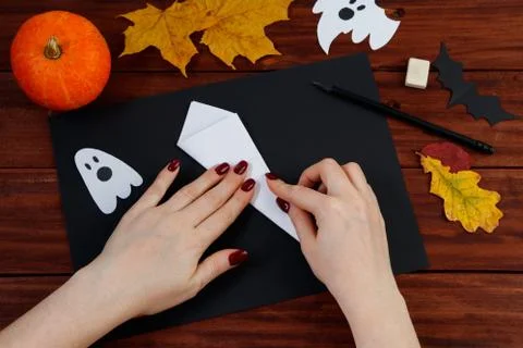 Halloween DIY. Step-by-step instructions for making a spider web from paper. Stock Photos