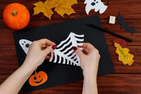 Halloween DIY. Step-by-step instructions for cutting a spider web from paper  Stock Photos