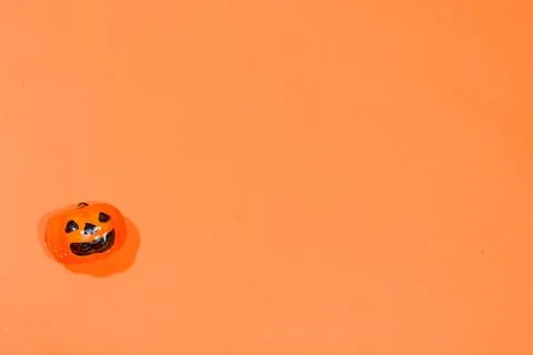 Halloween double border of scattered candy and decor. Flat lay over an oran.. Stock Photos