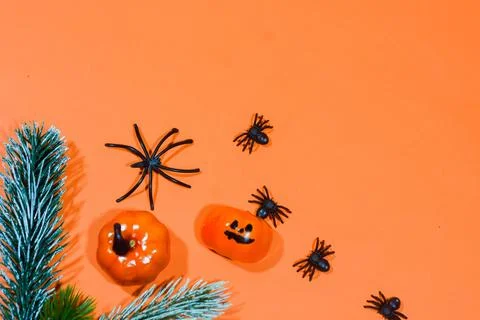 Halloween double border of scattered candy and decor. Flat lay over an oran.. Stock Photos