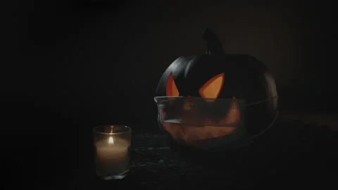 Halloween during Pandemic Setting Jack-O'-Lantern wearing Face Mask | Still Shot Stock Footage 138178333