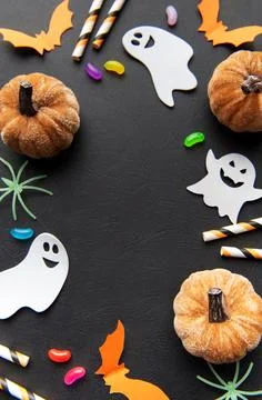 Halloween flat lay with spooky ghost pumpkins candy Fotos de archivo