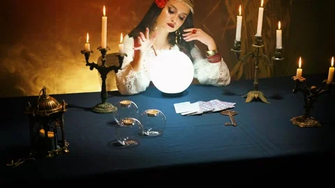 Halloween fortune tellers hand waving over magic crystal ball. fantasy woman Stock Footage 263906178