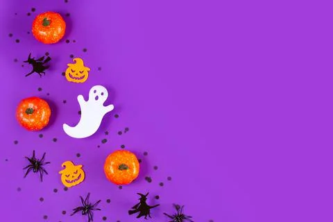 Halloween frame with pumpkins, ghost and spiders on purple Background. Stock Photos