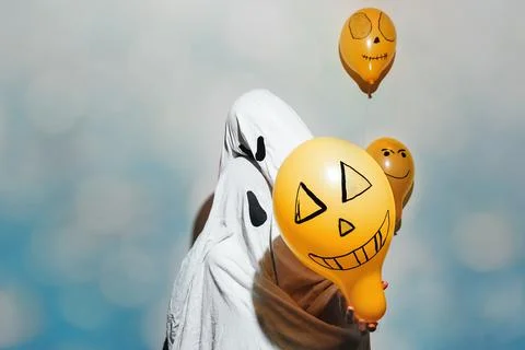Halloween ghosts on blue background Stock Photos