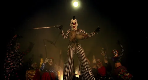 Halloween horror clowns party. Scary clown on stilts. Stock Footage
