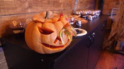 Halloween Jack-O-Lantern Pumpkin and Spooky Dessert Buffet Table Stock Footage 336809134