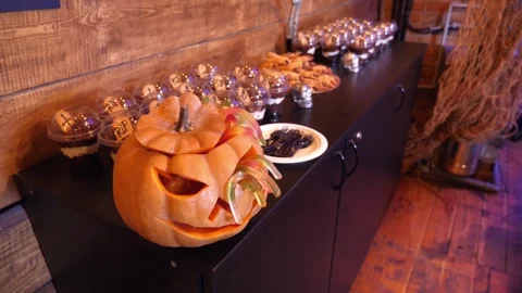 Halloween Jack-O-Lantern Pumpkin and Spooky Dessert Buffet Table Video stock 336809203