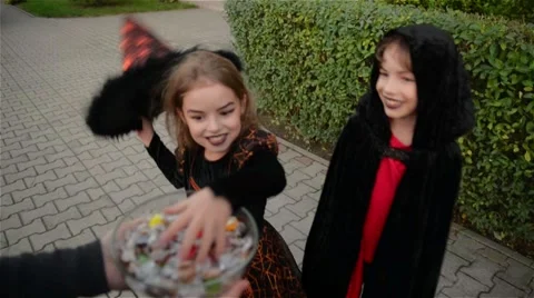 Halloween, Kids Want Halloween Candy, Children wearing witch costumes with hats Stock Footage