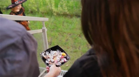 Halloween, Kids Want Halloween Candy, Children wearing witch costumes with hats Stock Footage