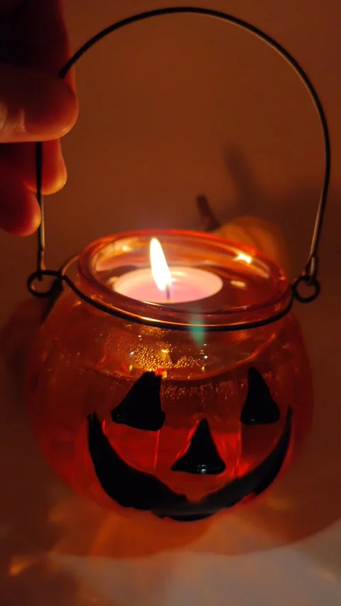 Halloween lantern in hand macro photography 動画素材 319689802