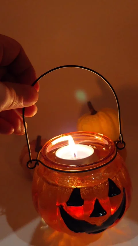 Halloween lantern in hand moving macro photography Stock Footage 319689627