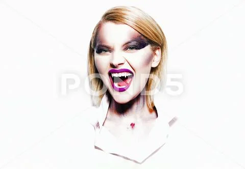 Halloween make up. Beautiful woman doing Halloween makeup. Fashion and beauty Stock Photos