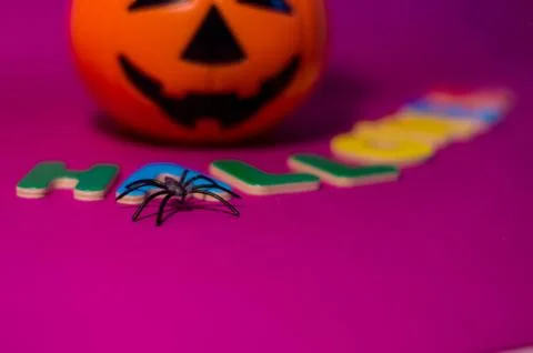 Halloween message made with letters between a pumpkin. Stock Photos