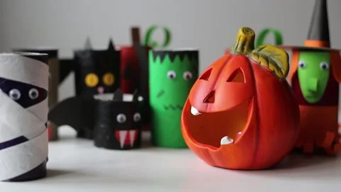 Halloween monsters from toilet paper rolls. Children's crafts for Halloween. Stock Footage