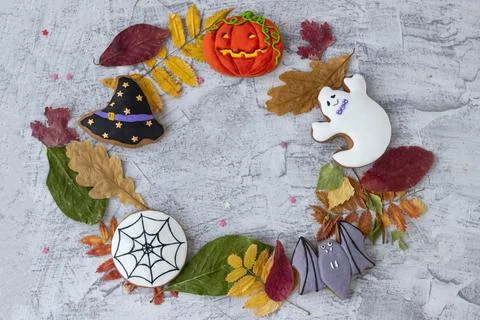 Halloween objects in circle on textured concrete. Halloween background with c Stock Photos