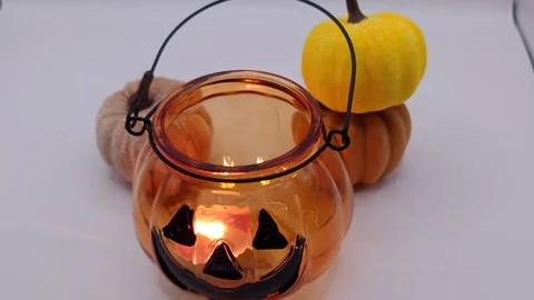 Halloween orange lantern pumpkin on a light background Stock Footage 319690572