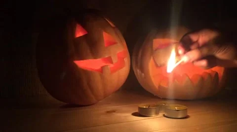 Halloween orange pumpkins jack lantern with candles on a wooden background Stock Footage 56092713