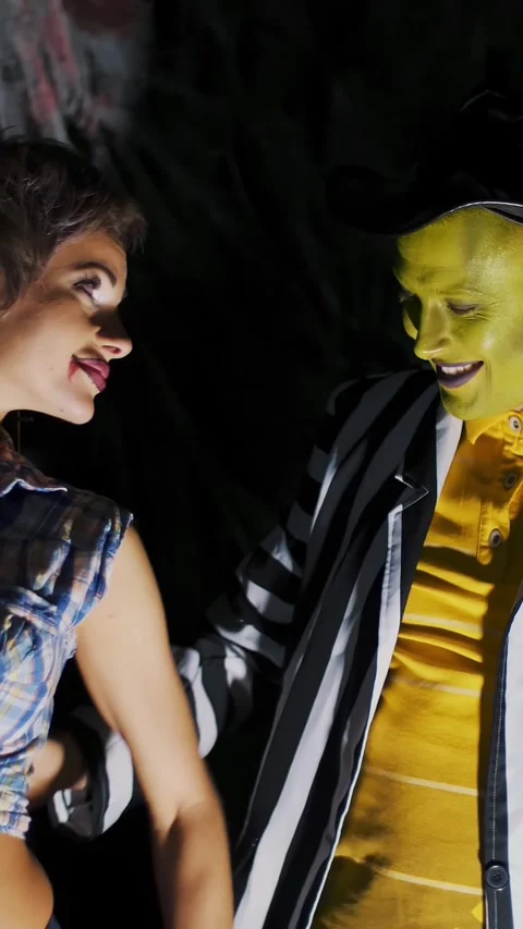 Halloween party, night, in the rays of light, a man with a terrible make-up, Stock Footage 305935841