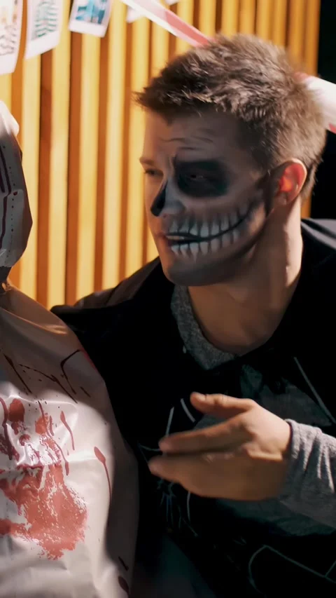 Halloween party, night, twilight, in the rays of light, a man with a terrible Stock Footage 304638826
