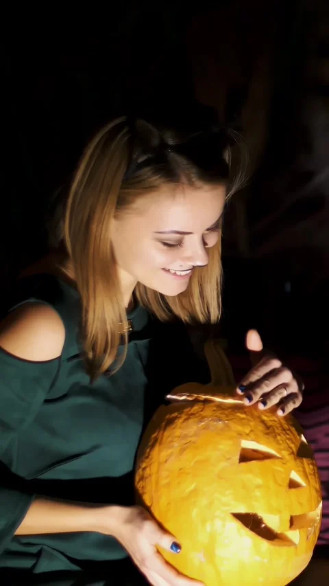 Halloween party, night, twilight, in the rays of light, girl dressed in costume Stock Footage 304638883