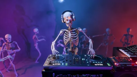 Halloween party: skeleton DJ surrounded by dancing spooky skeletons Stock Footage 285958249