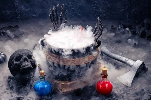 Halloween potion brewing in a dark setting. Stock Photos