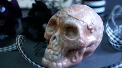 Halloween props on table tight on skull 스톡 동영상 202592339