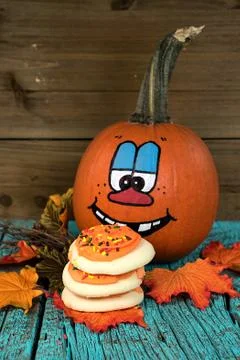 Halloween pumpkin with cookie stack Stock Photos