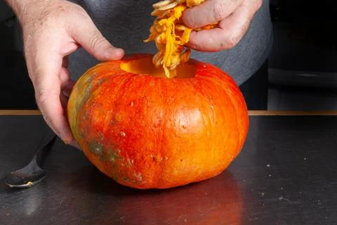 Halloween pumpkin cutting process, process of making Jack-o-lantern. Stock Photos