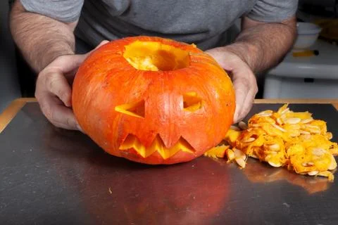 Halloween pumpkin cutting process, process of making Jack-o-lantern. Stock Photos