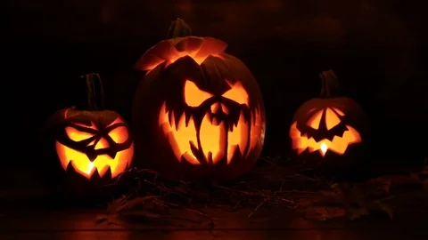 Halloween Pumpkin On Dark Background With Lights On Top Backward Видео 81354670
