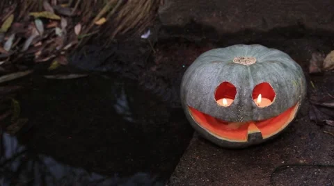 Halloween pumpkin at the dark pool 動画素材 68748120