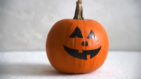 Halloween pumpkin with drawing face Stock Footage 154375736