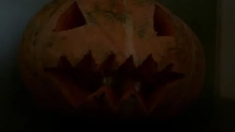 Halloween pumpkin glowing with inner fire at night Stock Footage 319428906