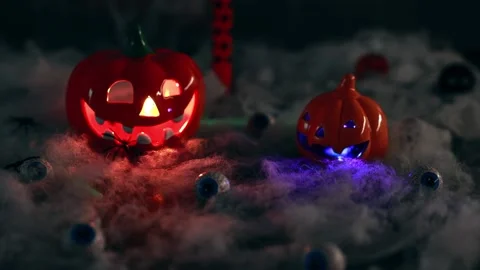 The Halloween pumpkin glows with different colors from the inside. Stock Footage 217686031