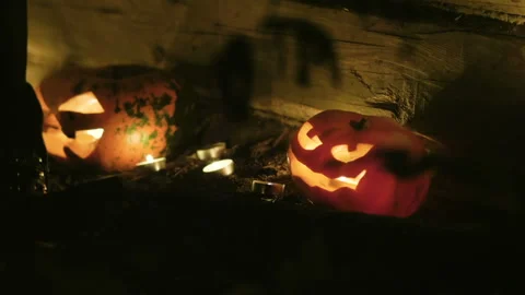 Halloween pumpkin head jack lantern with burning candles on black background. HD 库存影片 95621460