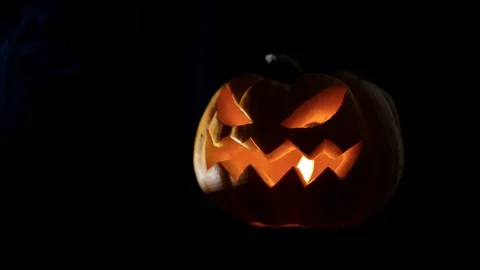 Halloween pumpkin Jack o lantern with candle lights at night Stock Footage 115889944