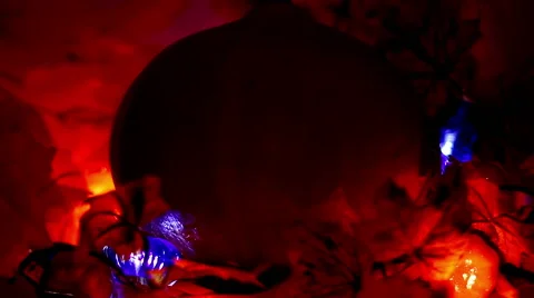 Halloween. Pumpkin is in the maple leaves in beatiful light Stock Footage 68659323