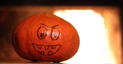 Halloween Pumpkin with a painted face on a background of fire Stock-Footage 116083231