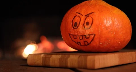 Halloween Pumpkin with a painted face on a background of fire Stock-Footage 116083341