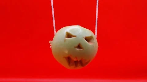 Halloween pumpkin on a rope Stock Footage 344455312