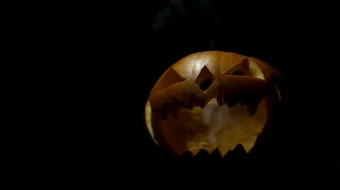 Halloween Pumpkin Smoking in the dark Stock Footage 13420028