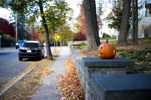 Halloween pumpkin on stoop Stock Photos
