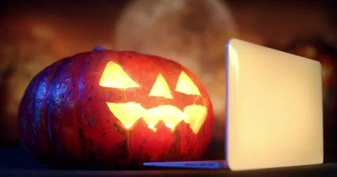 Halloween Pumpkin using laptop, watching laptop online Stock-Footage 250351202