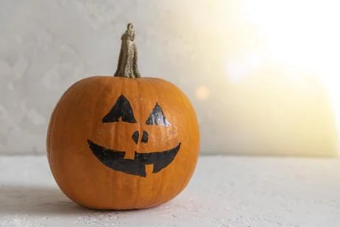 Halloween pumpkin on white table Stock Photos