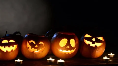 Halloween pumpkins on black background Stock Footage 80119540