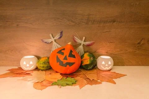 Halloween pumpkins, burning squash shape lanterns, straw angels, and dry autu Stock Photos