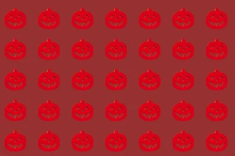 Halloween pumpkins pattern. Many scary pumpkin faces background Ilustração Stock